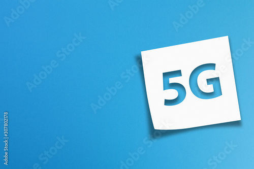 Note paper with 5G communication wifi technology concept on blue background