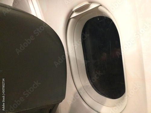 Airplane Window And Seat at Night