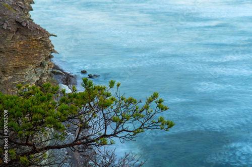 Sunrise over ocean at the amazing Hogklint on the island of Gotland in Sweden