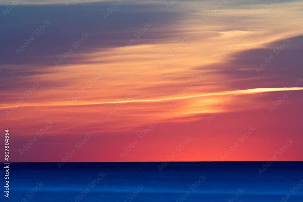 Beautiful deep blue ocean with amazing color sunset in background in the Baltic Sea, Sweden