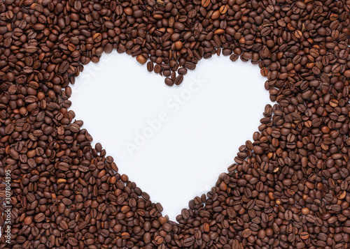 Coffee heart. Heart shape made from coffee beans. Top view.