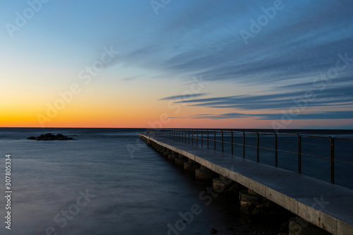 Vibrant orange colored sky during summer sunset over the Baltic Sea, Sweden © It4All