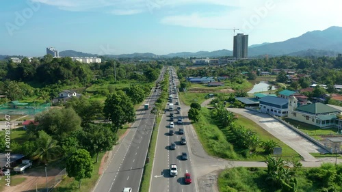 4K Aerial Drone Footage Of daily lifestyle of local people during morning with heavy traffic jam at Menggatal Town, Sabah, Malaysia photo