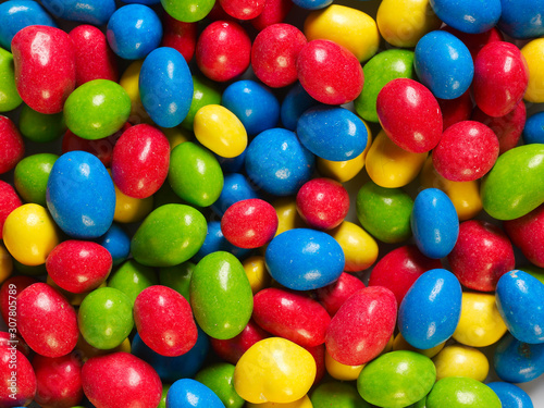 background of colorful peanut chocolate snack with green  red  yellow and blue