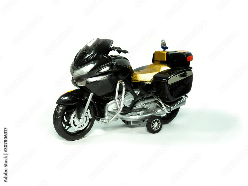 Children's toy. Motorcycle model made of plastic on a white background.
