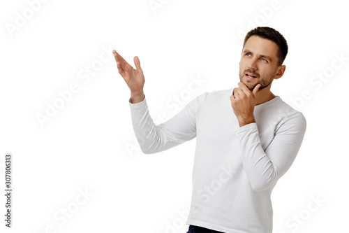 portrait of doubtful bearded man in casual white shirt asking questions isolated on white background. copy space © producer