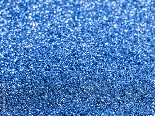 Sparkling background with bokeh made of Classic Blue 2020 color. Color of year 2020 blurred backdrop for holidays and parties. COY2020 Classic Blue concept. Copy space for text