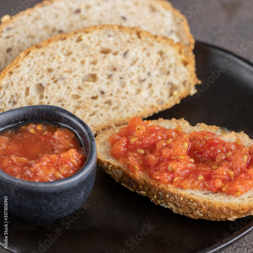 Pa amb tomaquet or tomaca (bread with tomato) classic snack in Catalan and Spanish cuisine, eaten for breakfast.