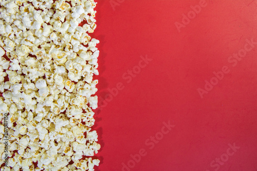 popcorn at right side of frame on a vibrant red background movie film theater background