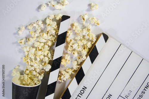 top angle shot of film movie clapperboard with black color popcorn box on white background film video production