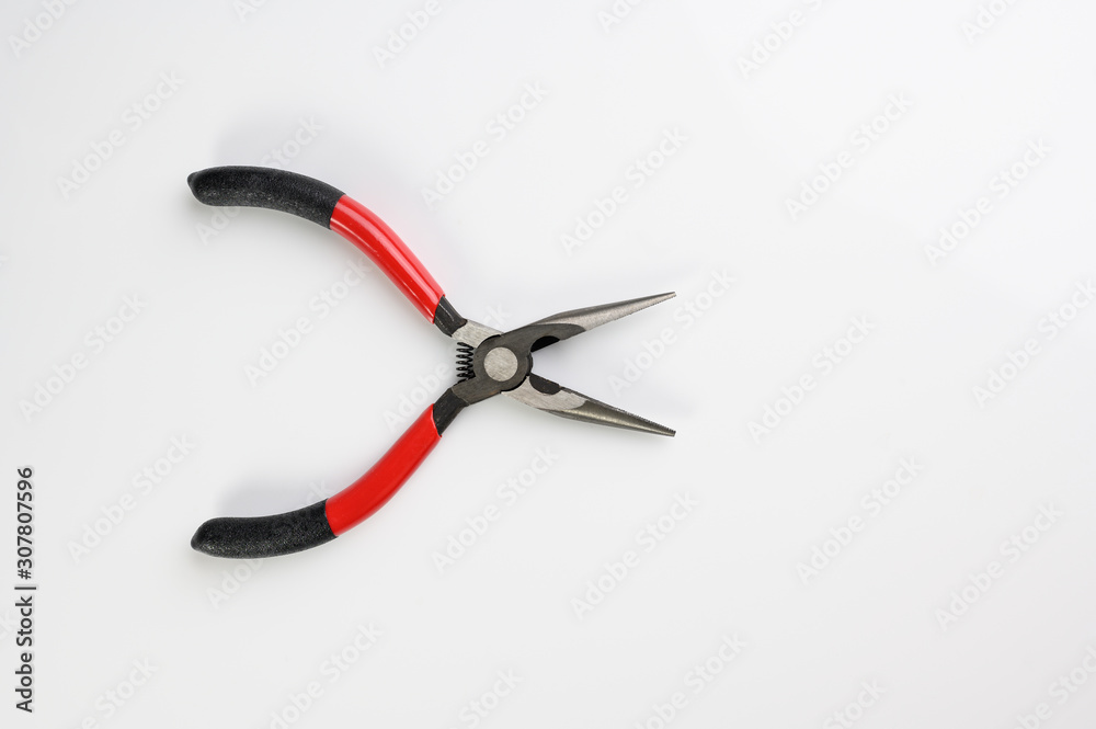 small spring loaded hand long nosed pliers for precision repairs and electrical work