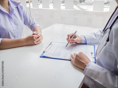 The doctor explained the health examination results to the patient, medical checkup concept