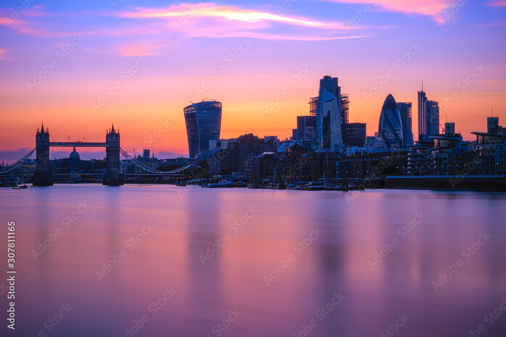 Long exposure, Tower bridge and London cityscape with river Thames