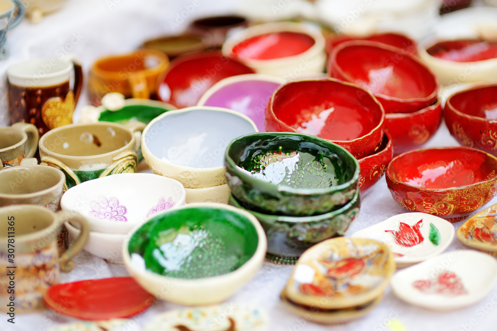 Ceramic dishes, tableware and jugs sold on Easter market in Vilnius, Lithuania Ceramic dishes, tableware and jugs sold on Easter market in Vilnius, Lithuania
