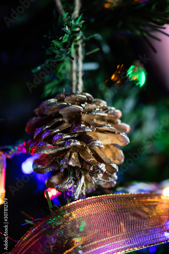 Christmas concept. Decorated Christmas tree, Fir braches with hanging decorations and garlands.