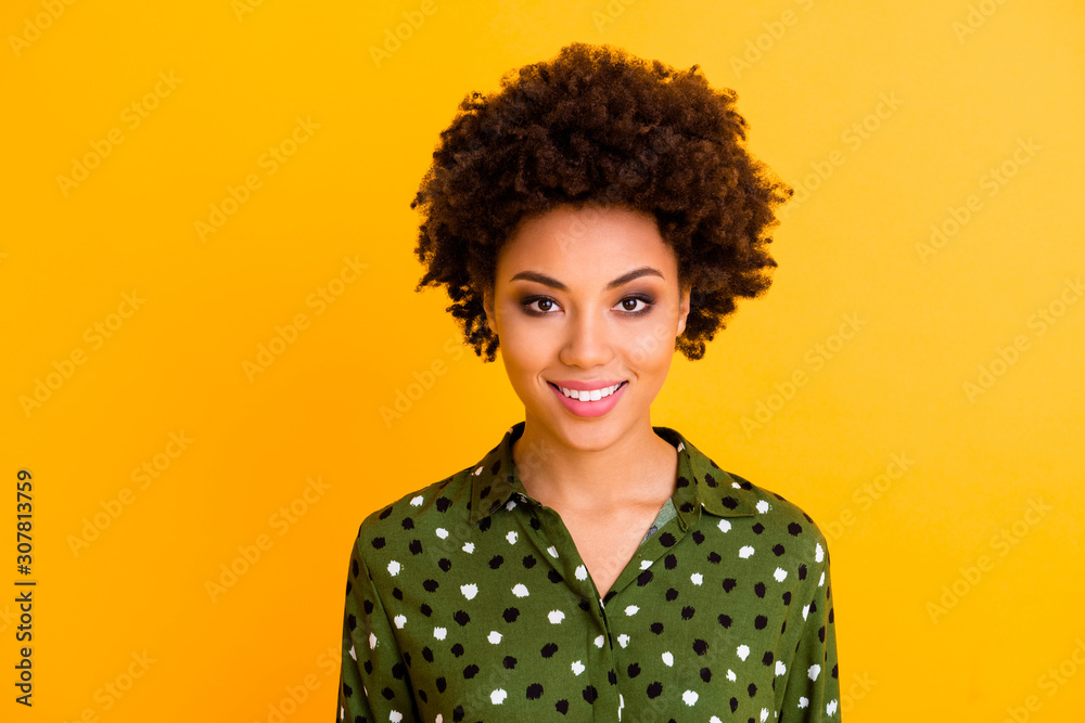 Photo of beautiful pretty dark skin wavy lady toothy beaming smiling positive good mood easy-going person wear green dotted shirt blouse isolated yellow color background Photo of beautiful pretty dark skin wavy lady toothy beaming smiling positive good mood easy-going person wear green dotted shirt blouse isolated yellow color background