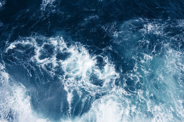 Top view on blue ocean waves. Nature background.