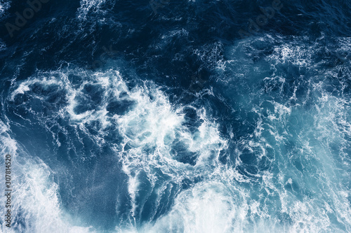 Top view on blue ocean waves. Nature background. © Olga Zarytska