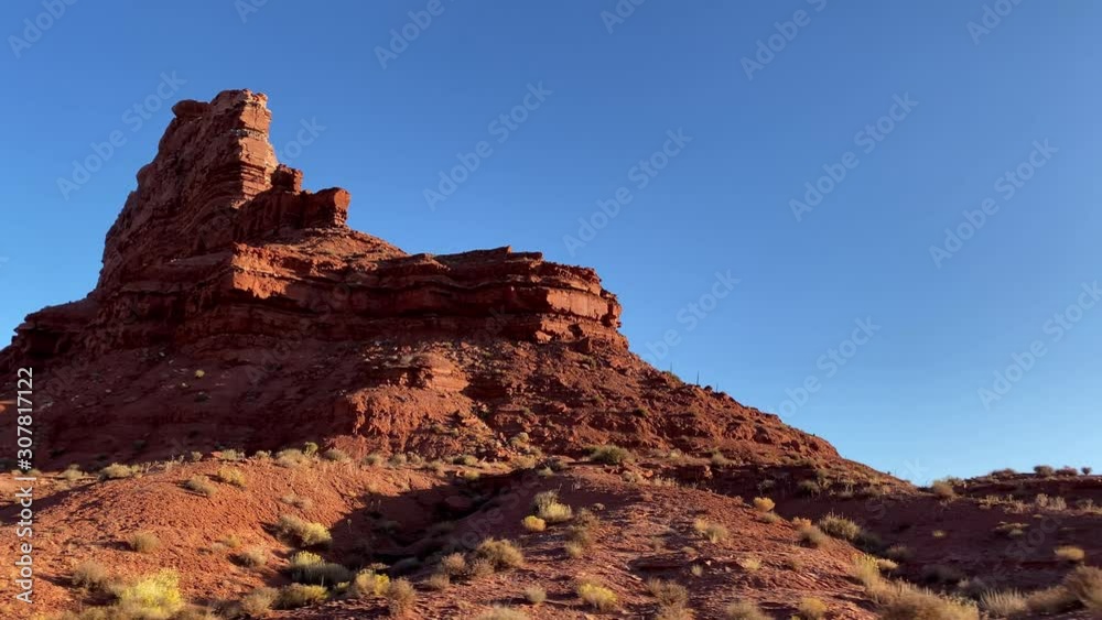 Driving past the amazing rock formations of the Valley of the Gods in Southern Utah Driving past the amazing rock formations of the Valley of the Gods in Southern Utah