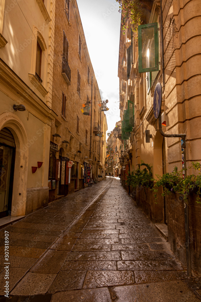 View at narrow street in Italy.