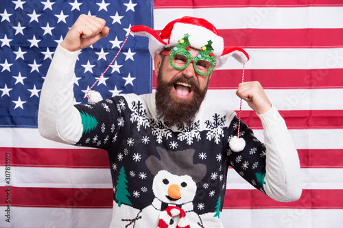 American guy joined cheerful celebration. American tradition. Santa Claus on american flag. Celebrate xmas and new year. Christmas tradition from USA. Proud of my country. Winter holidays season © be free