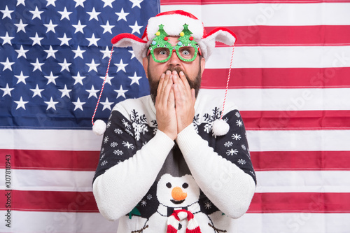 it is unreal. Patriotic decoration ideal for celebrating. winter holidays. american xmas party. Christmas greeting from USA. Santa on american flag background. Bearded american man celebrate new year © be free