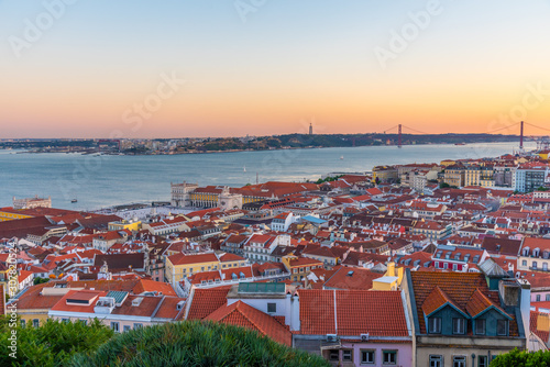 Sunset view of cityscape of Lisbon with Praca do Comercio square, Portugal photo