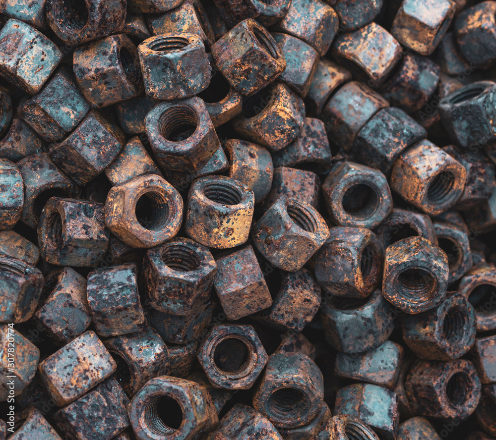 close up of rusty screw nuts and bolts