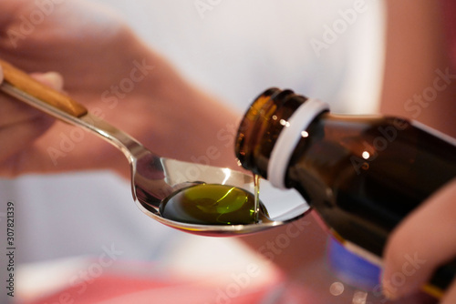 take medicine with spoon