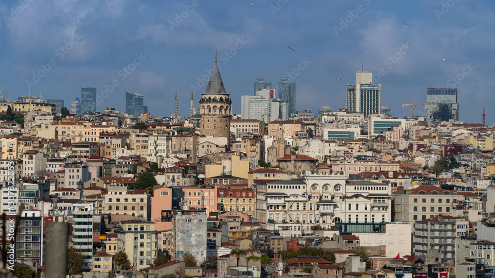 Galata Tower and Mosque dome silhouette with Bosphorus landscape in Golden Horn of Istanbul city