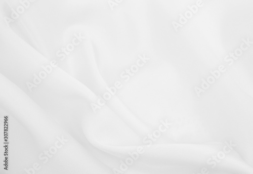 Smooth elegant white silk or satin luxury cloth texture as wedding background. Luxurious background design