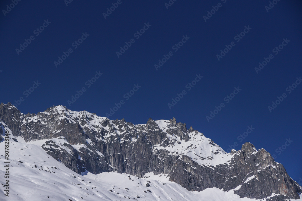 scenic view of snowcapped mountains against clear blue sky