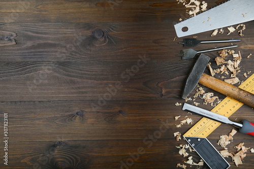 carpentry tools on wooden background with copy space
