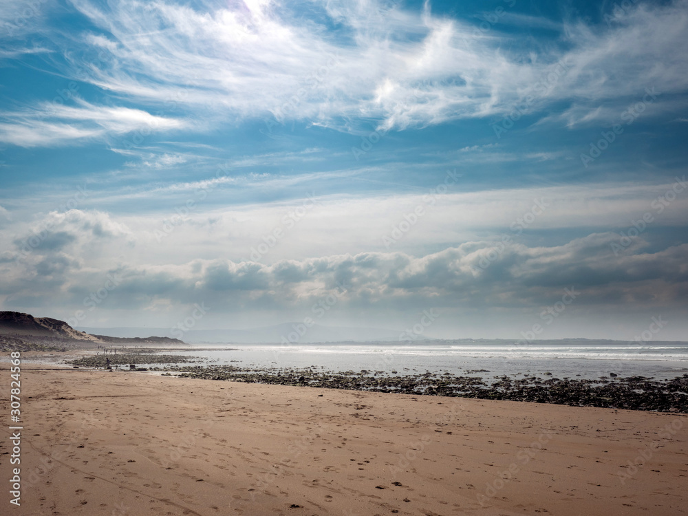 Beautiful clouds over Strandhill sandy beach, county Sligo, Low tide, Calm and peaceful scene. Ireland. Atlantic ocean,