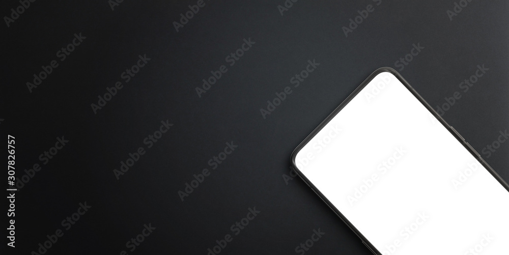 Modern mobile phone close-up on black surface. Isolated screen for mockup, app presentation. Copy space beside for promo text - obrazy, fototapety, plakaty 