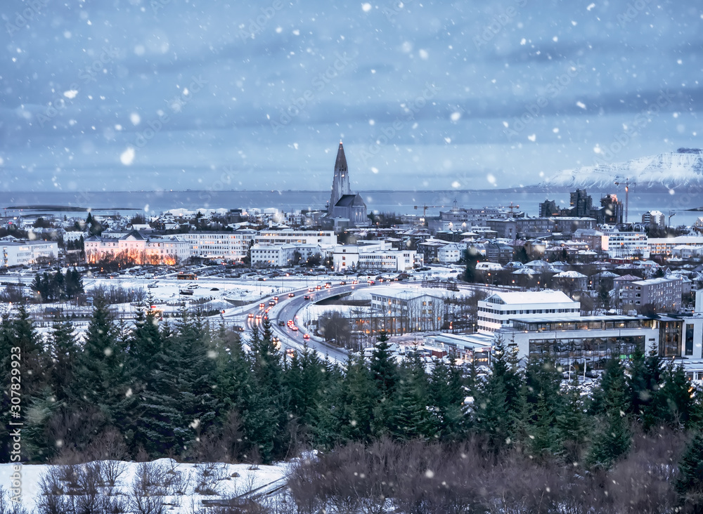 Reykjavik, Iceland, Europe, December 24.  Aerial cityscape during a snowstorm at Christmas - obrazy, fototapety, plakaty 