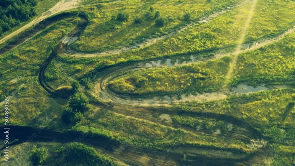 Motocross motorcycles training on a track, aerial view Motocross motorcycles training on a track, aerial view
