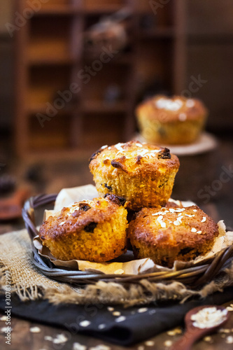 Fresh homemade delicious apple and carrot muffins with dried fruits and nuts