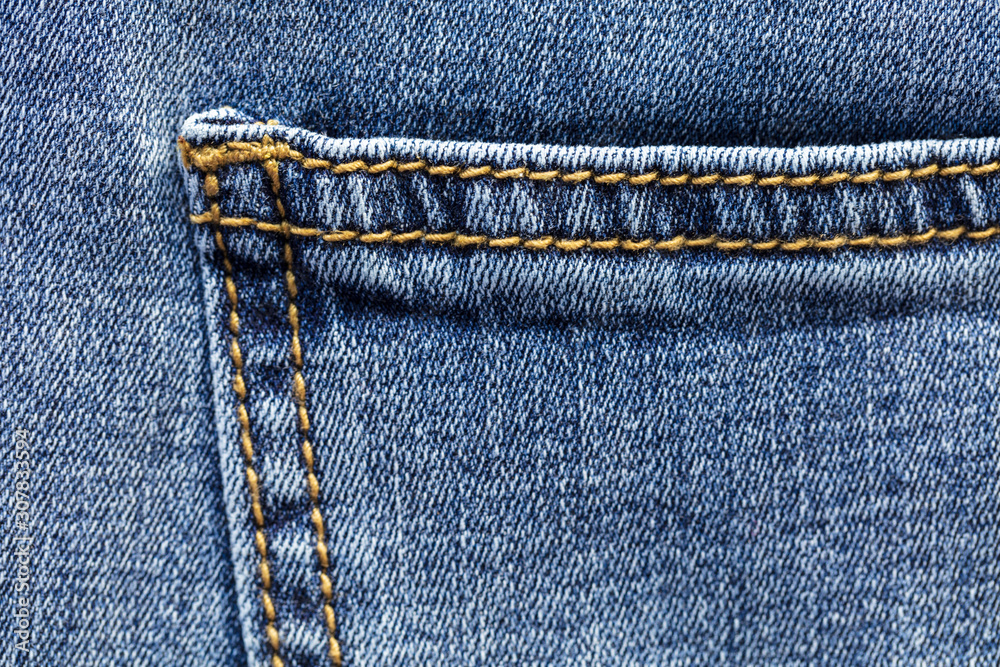 Close up view of blue jeans pocket Close up view of blue jeans pocket