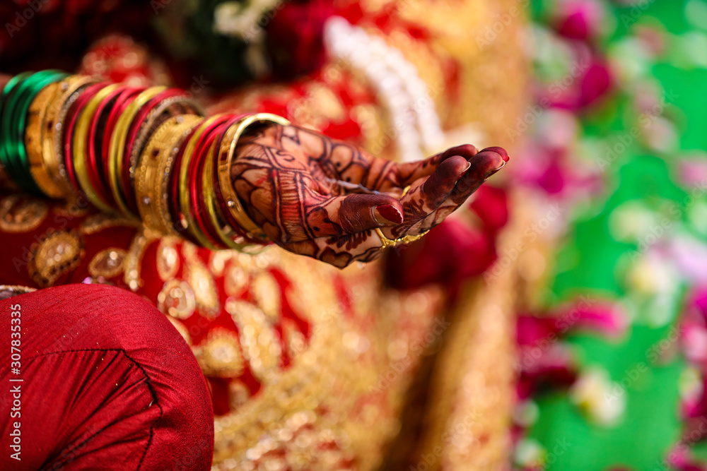 Indian traditional wedding ceremony : bridal hand with mehandi design 
