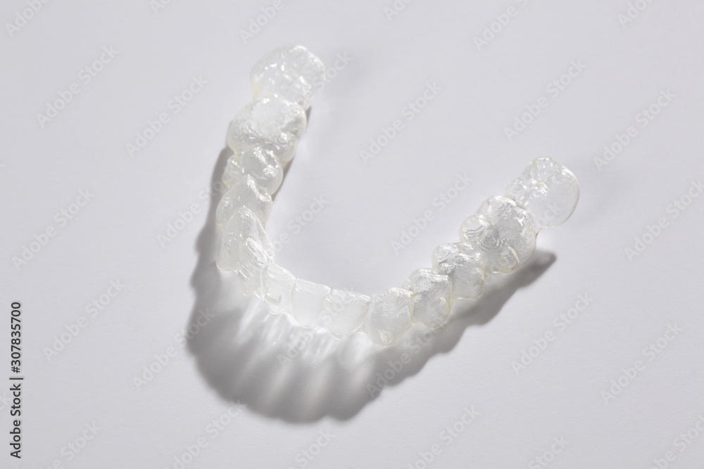 transparent teeth brace aligenr isolated on white background with copy space for your space transparent teeth brace aligenr isolated on white background with copy space for your space