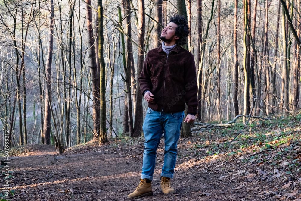 man in forest looking up