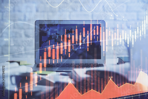 Stock market graph and table with computer background. Multi exposure. Concept of financial analysis. © peshkova