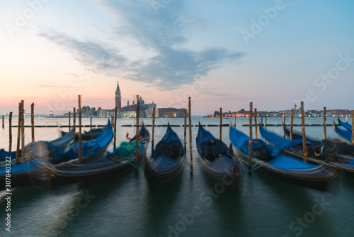 Sunrise of Venice Grand Canal with gondola in foreground on the sea © Sen