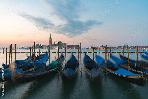 Sunrise of Venice Grand Canal with gondola in foreground on the sea © Sen