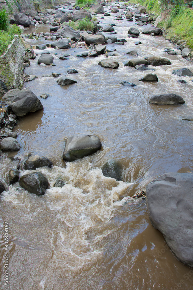 Fototapeta premium water flowing over rocks on a river creek