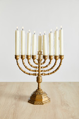 burning candles in menorah on Hanukkah isolated on white
