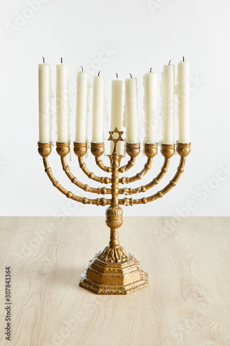 candles in menorah on Hanukkah isolated on white