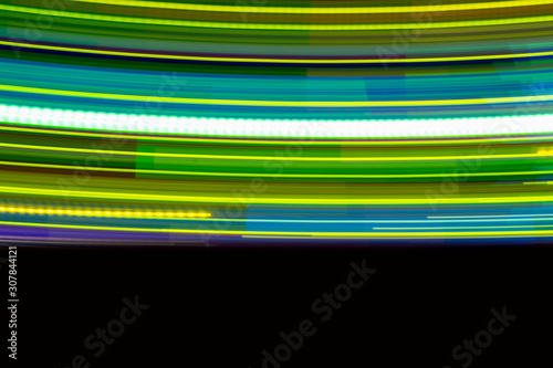 Colorful of neon lighting bulb glowing in the night for abstract background texture pattern with copy space text