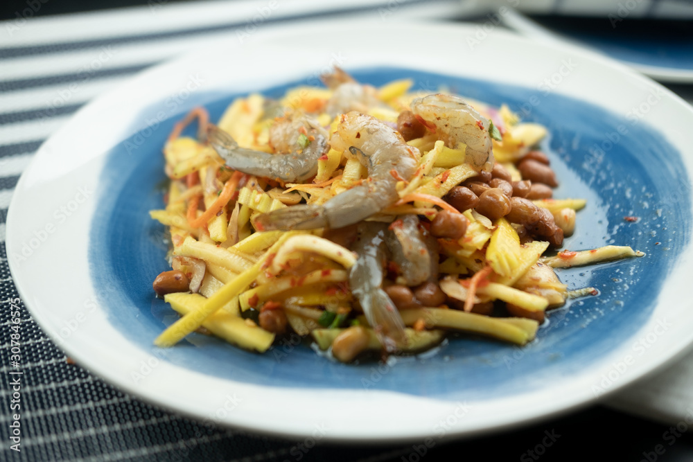 Spicy and sour mangoes salad with raw fresh shrimp Spicy and sour mangoes salad with raw fresh shrimp